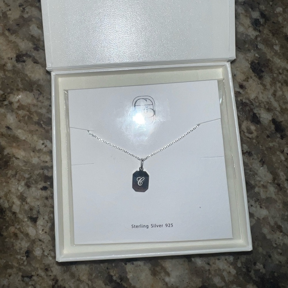 sterling silver “C” necklace. brand new in box.